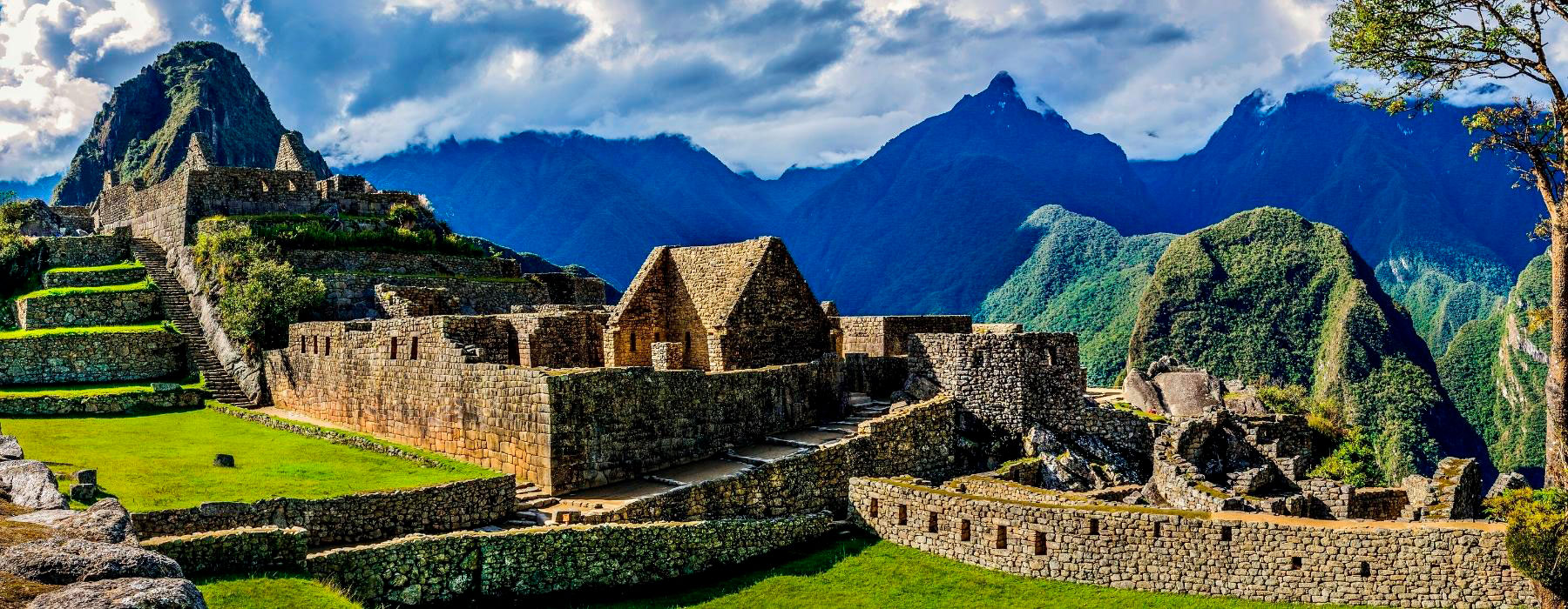 The ancient Inca citadel of Machu Picchu shrouded in mist in Peru.